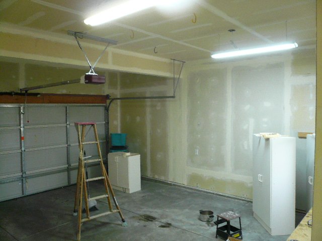 Taped drywall walls and ceiling in a garage, from the existing Drywall Ottawa website